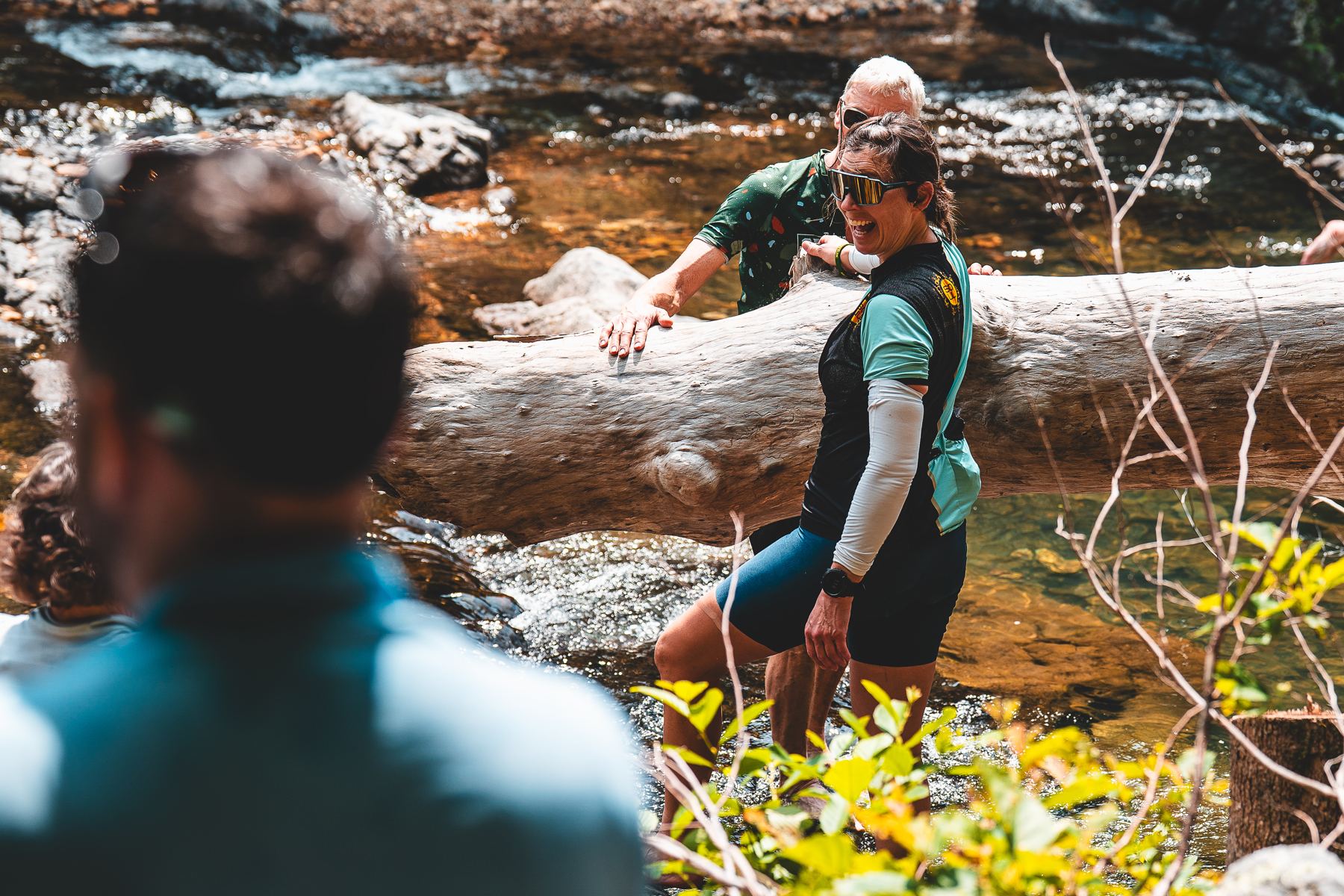 Riders laughing at a creek crossing