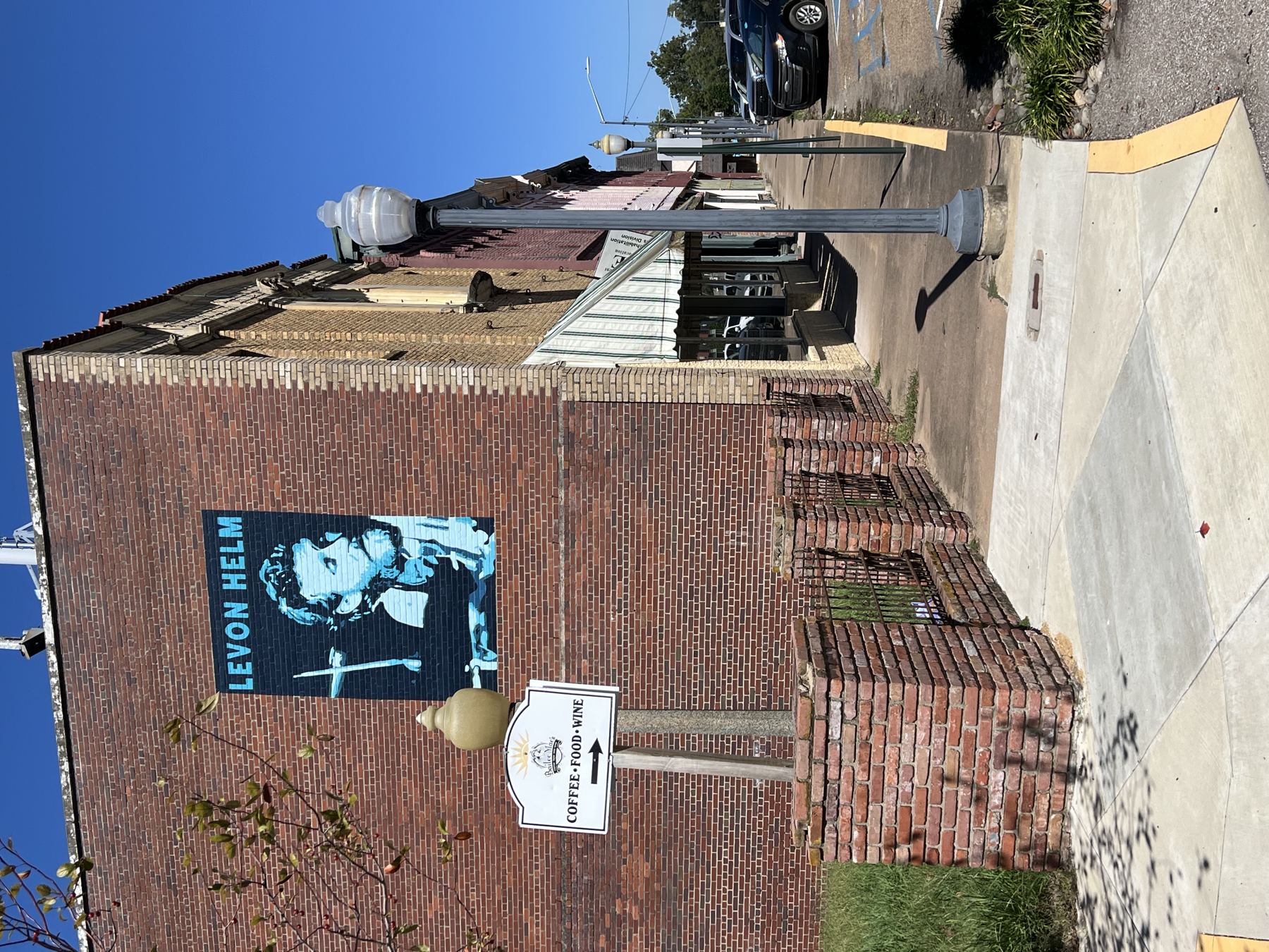 A Levon Helm mural on a brick wall in downtown Helena