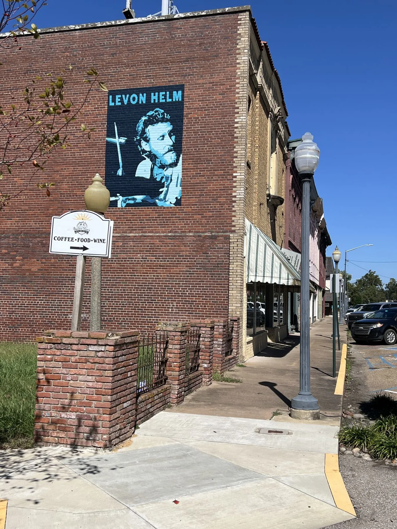 A Levon Helm mural on a brick wall in downtown Helena