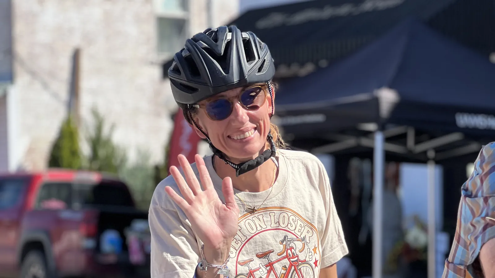 A Graveler rider waves while rolling out of Jonesboro on the morning of Day 2